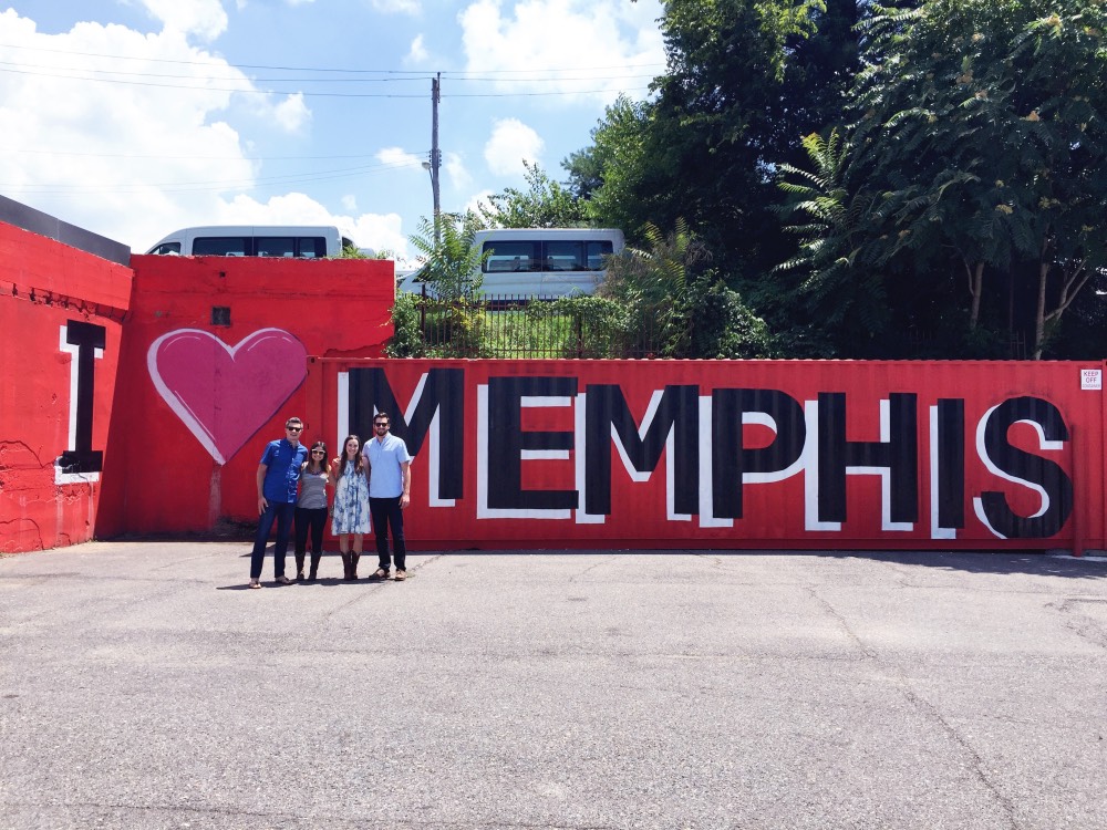 Taking a photo at the I Love Memphis Sign wall art in Cooper Young. 