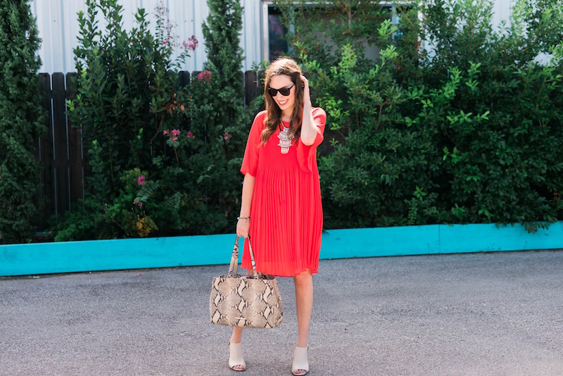 Styling a red anthropologie shift dress with snake print shoes and a matching tote. 