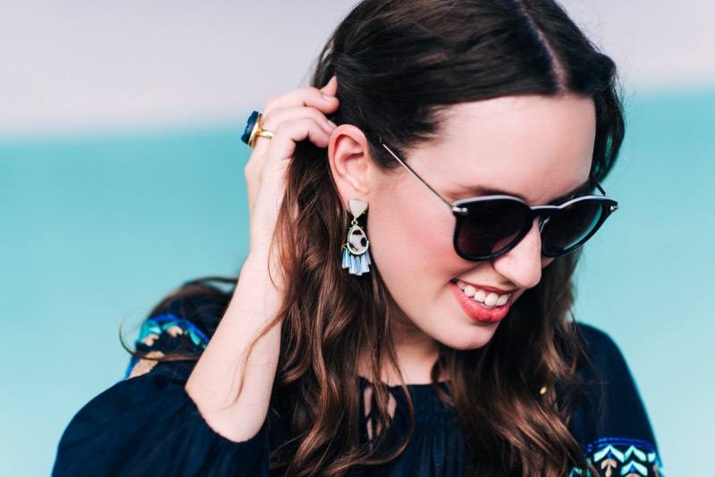 Blogger Alice Kerley from Lone Star Looking Glass pairs BaubleBar's Verbena Drop Statement earrings with a Blue Druzy Cocktail Ring. 