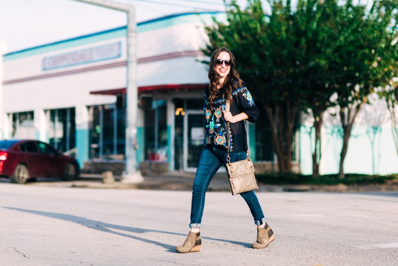 Blogger Alice Kerley from Lone Star Looking Glass gives fall outfit inspiration by wearing a navy KAS New York Embroidered Top with Hammitt Reversible Bag and Dansko Wedges.