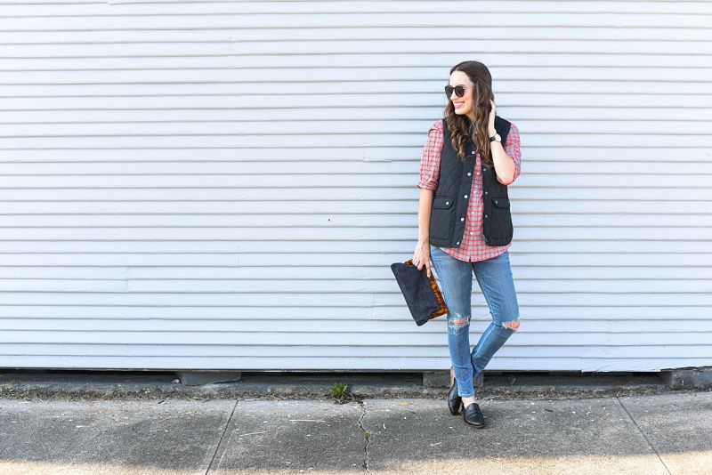 Alice Kerley of Lone Star Looking Glass styles a J.McLaughlin Plaid Lois Blouse, Black Vest and Denim Clutch for fall. 