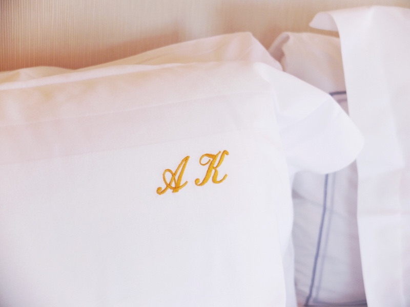 A guest room review and monogrammed pillows at The Carlyle in New York City.