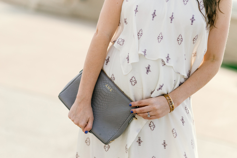 Texas fashion blogger Alice Kerley styles a gray Gigi New York monogrammed clutch.