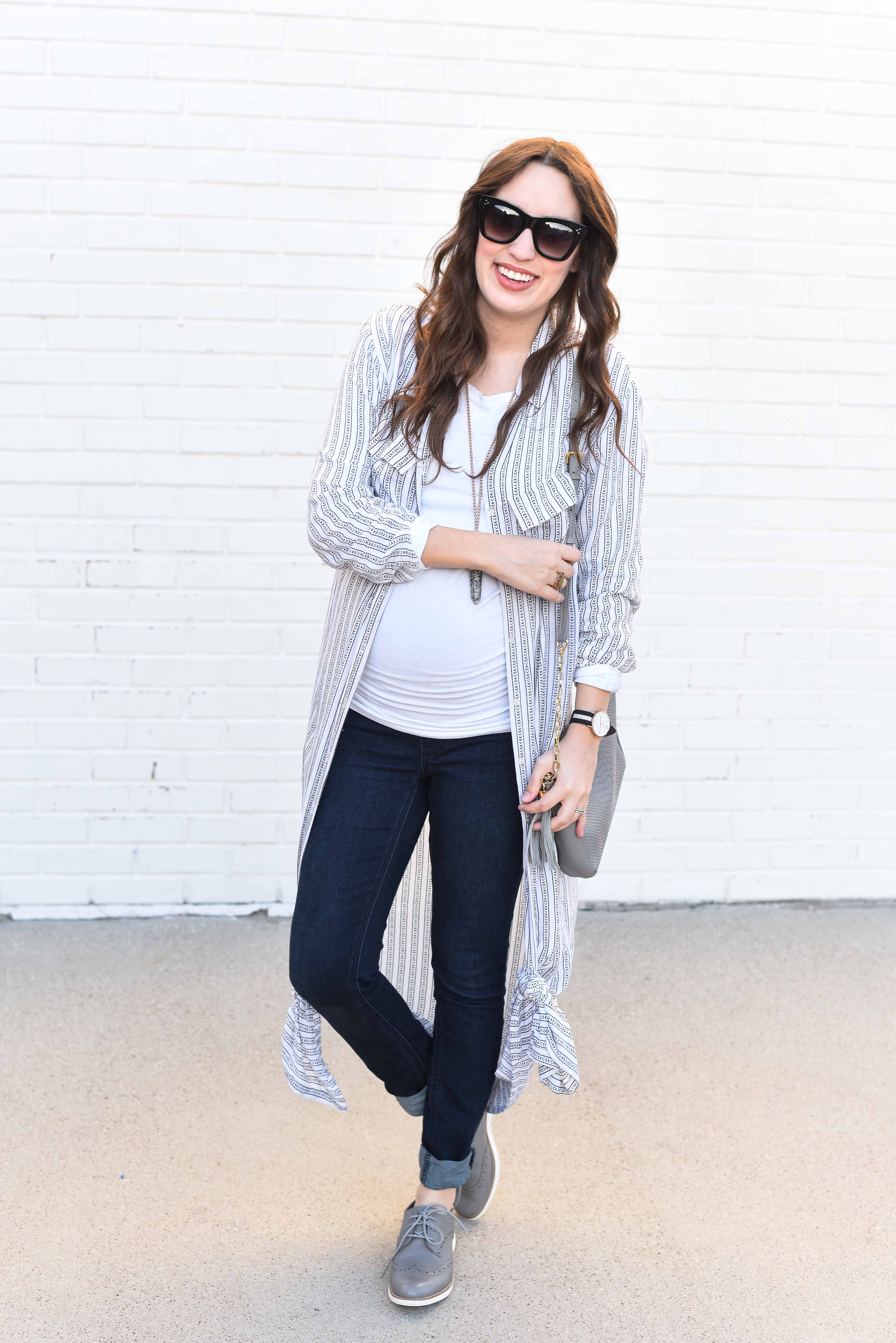 Fashion Blogger Alice Kerley styles a Planet Blue Button Down Dress over a tee and jeans for an easy maternity outfit. 