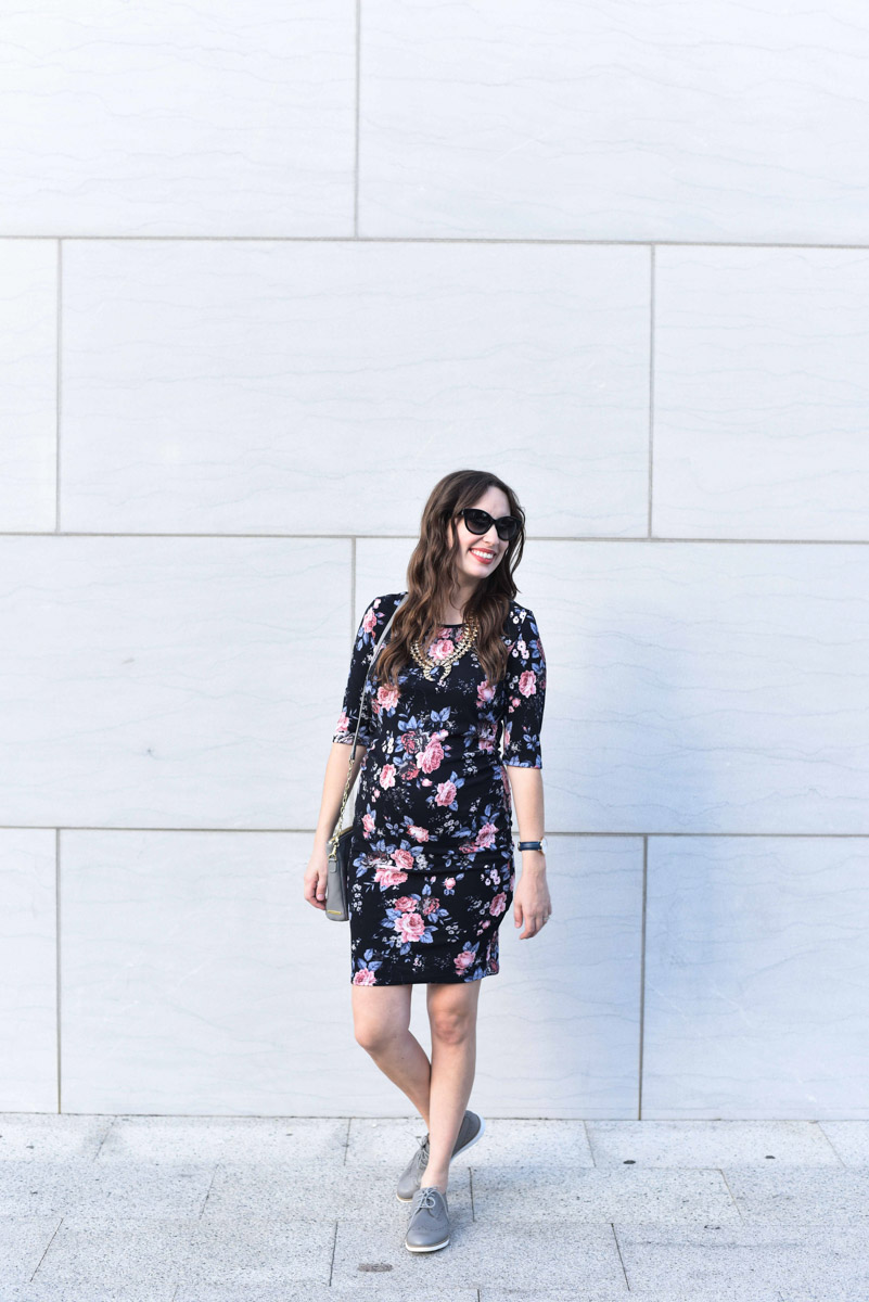 Houston fashion blogger Alice Kerley styles PinkBlush's black and floral fitted maternity dress with gray accessories for fall.