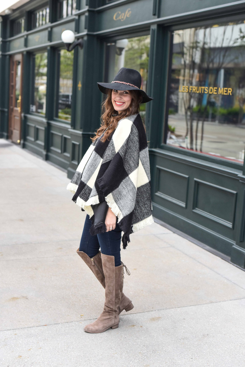 Texas blogger Alice Kerley shares fall outfit inspiration in a Tularosa plaid poncho and Elaine Turner Over the Knee Boots.