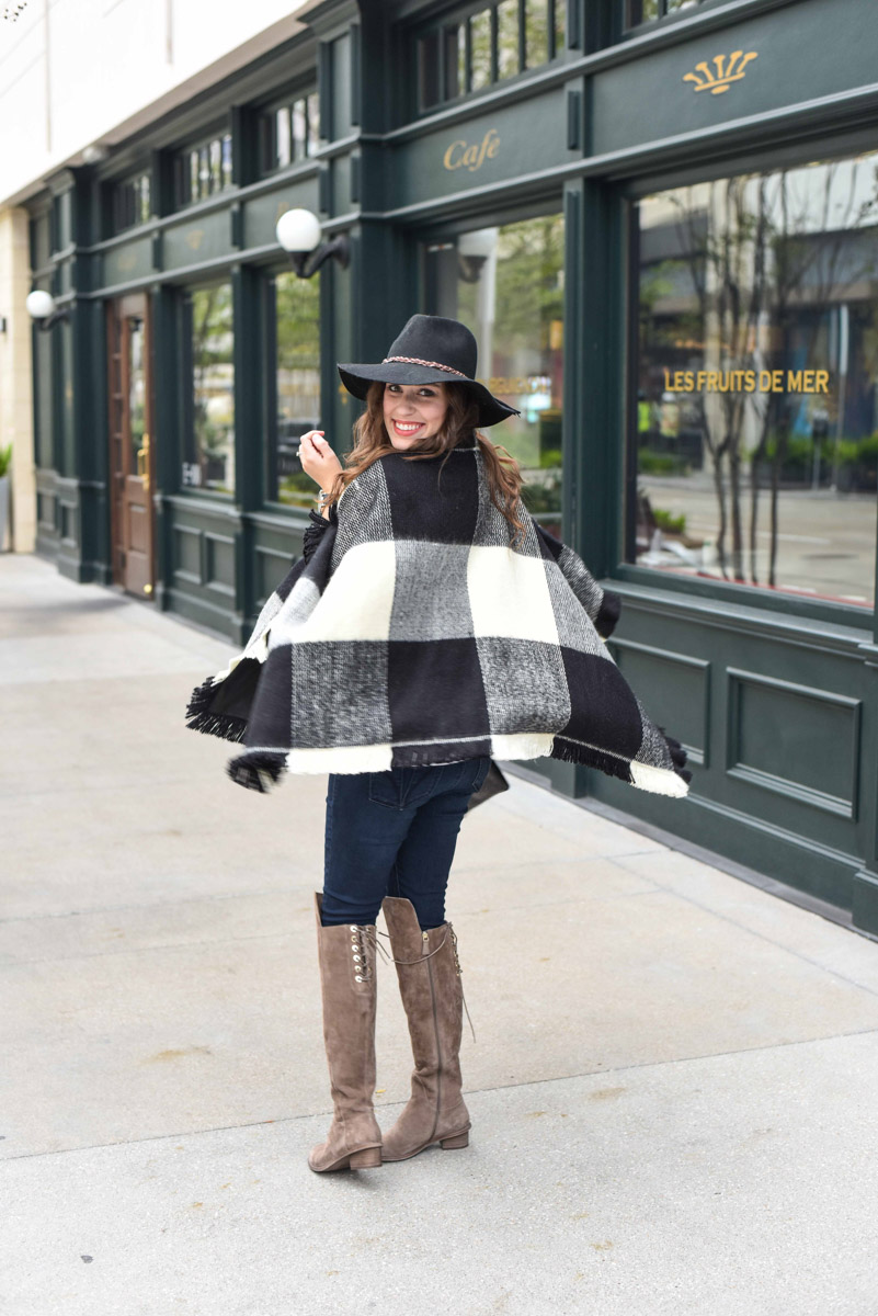 Texas blogger Alice Kerley shares fall outfit inspiration in a Tularosa plaid poncho and Elaine Turner Over the Knee Boots.