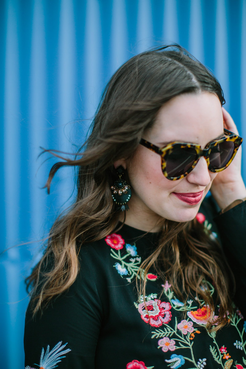 Houston fashion blogger styles black Baublebar Statement earrings with an embroidered top from Chicwish. 