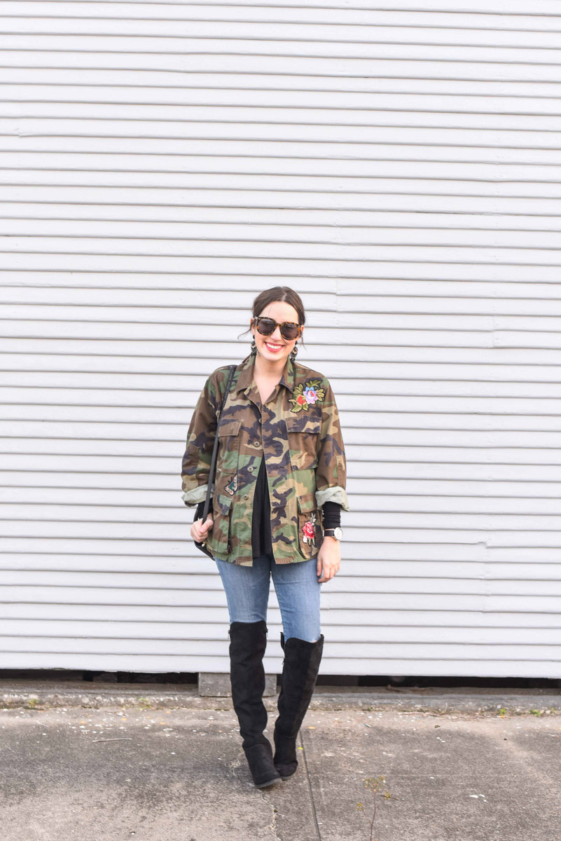 Houston fashion blogger styles an embroidered camo jacket from Planet Blue with skinny jeans, a black dagne dover tote and over the knee boots. 