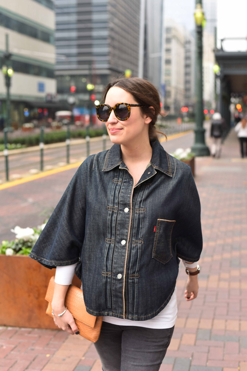 Houston fashion blogger styles her vintage levi's denim poncho with dark jeans, an elaine turner clutch and swedish hasbeens boots.