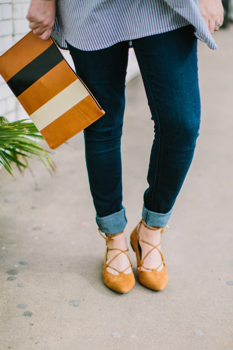 Houston fashion blogger styles a pea in the pod maternity jeans with vionic lace up flats and a clare vivier striped clutch. 