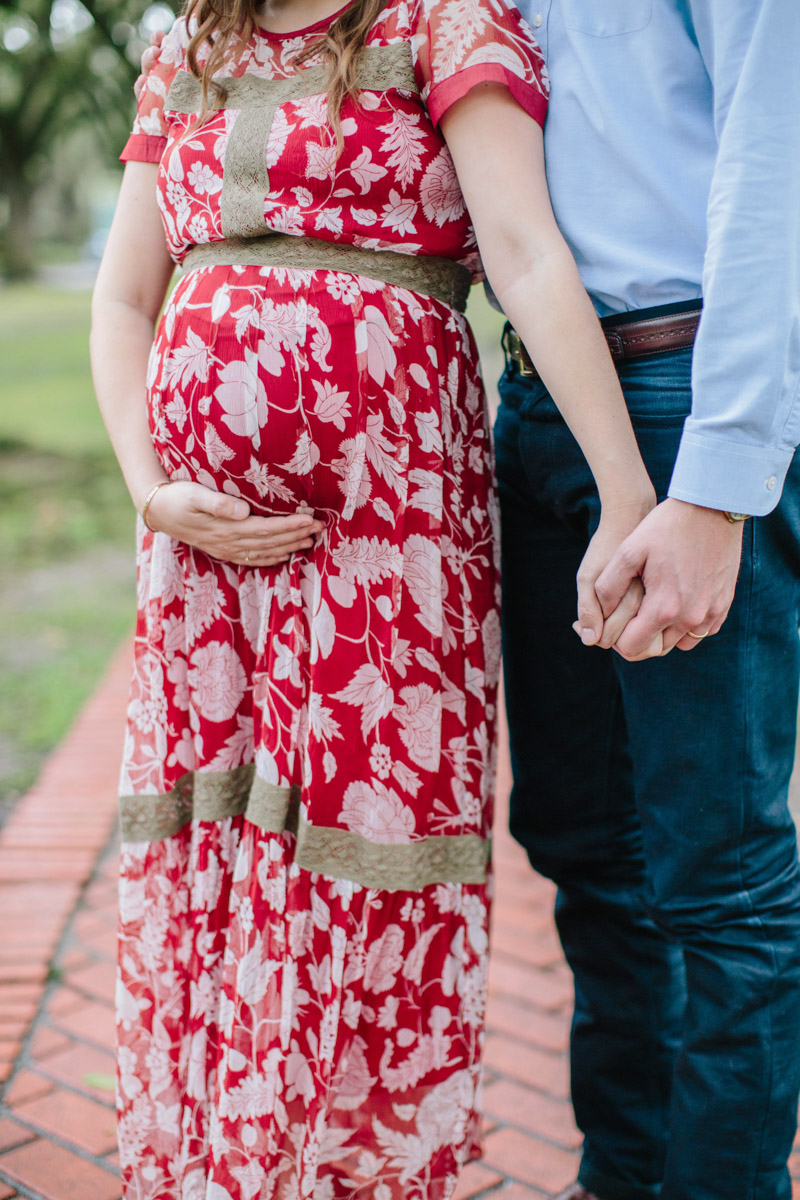 Houston, Texas maternity photo shoot, wearing a red maxi dress in the Museum District. 