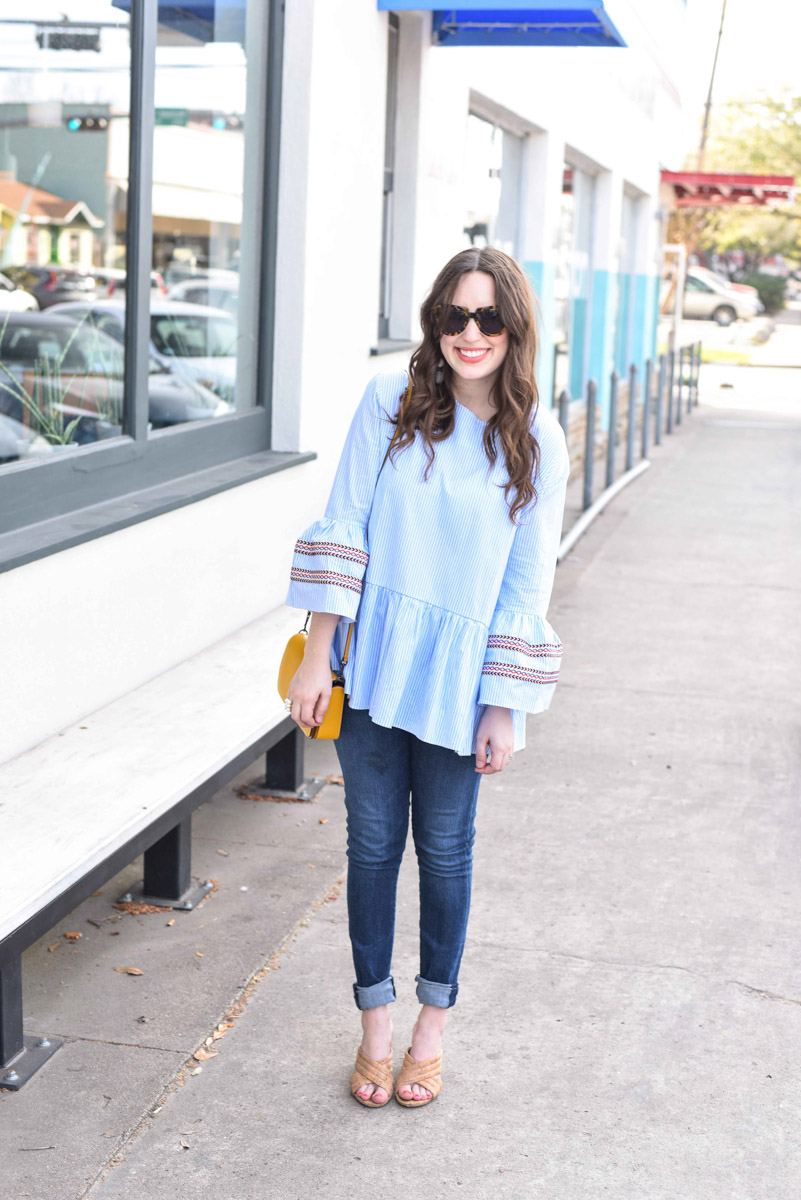 Houston fashion blogger styles a striped Chicwish Top with a yellow Coach Dinky crossbody.