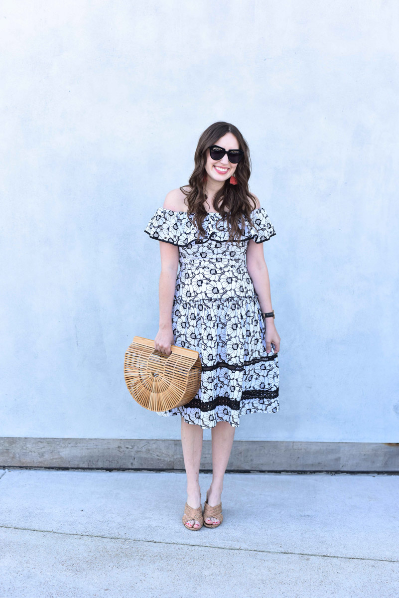 Houston blogger shares spring outfit inspiration in a black and white off the shoulder dress with a Cult Gaia bamboo bag.
