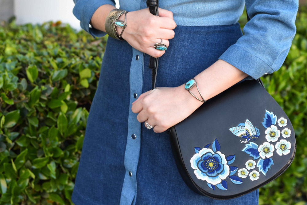 Rodeo boho style in a French Connection denim shirt dress with an embroidered saddle bag.
