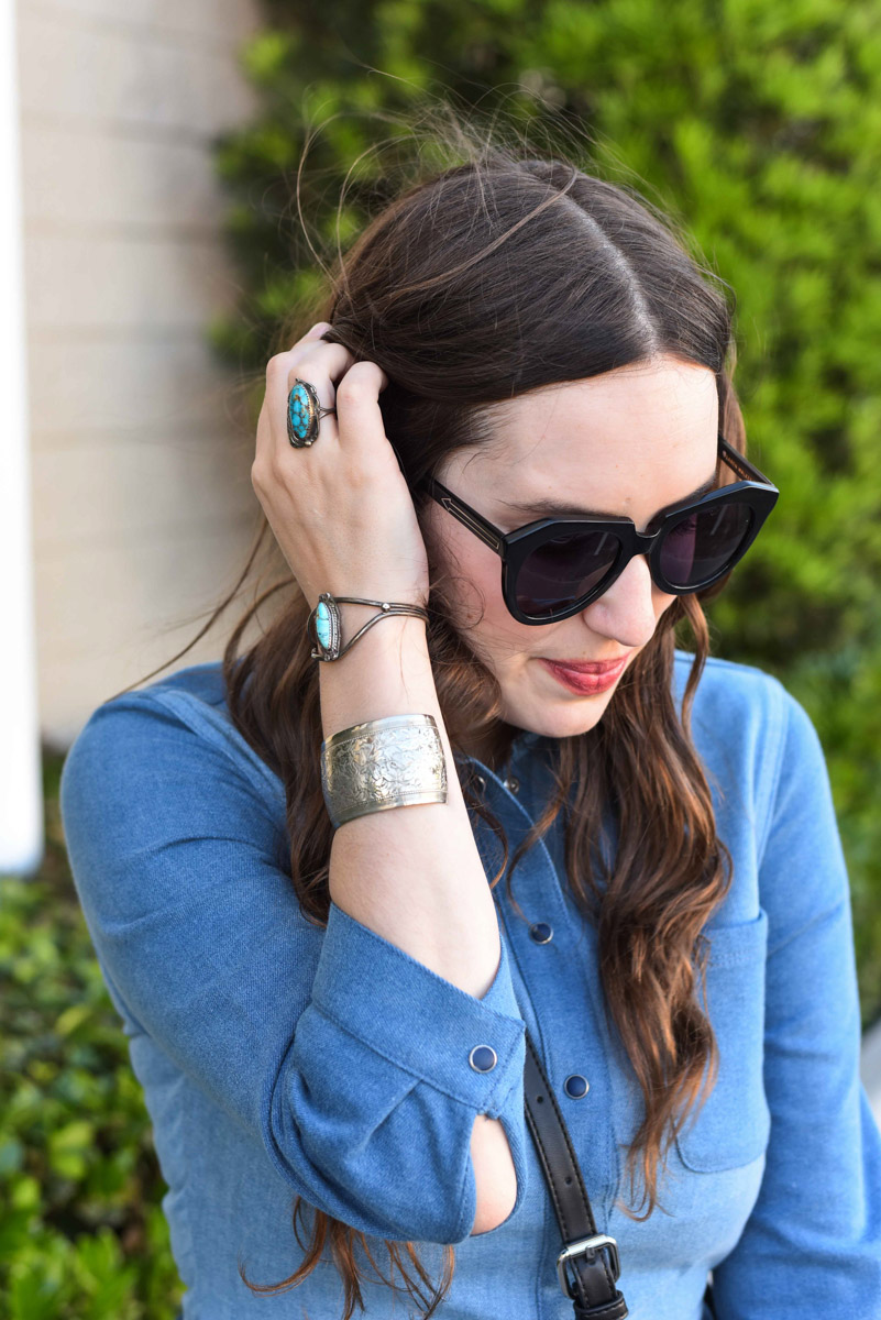 Rodeo boho style: Houston fashion blogger styles turquoise jewelry and denim shirtdress for a Southwestern look.