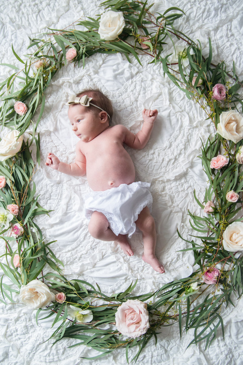 Newborn baby girl photography ideas: cuteheads lace bloomers and flower wreath.