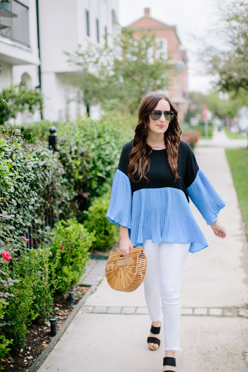 Houston blogger styles an outfit for spring: white true religion jeans, sole society wedges, a blue and black colorblocked chicwish top with a cult gaia handbag.
