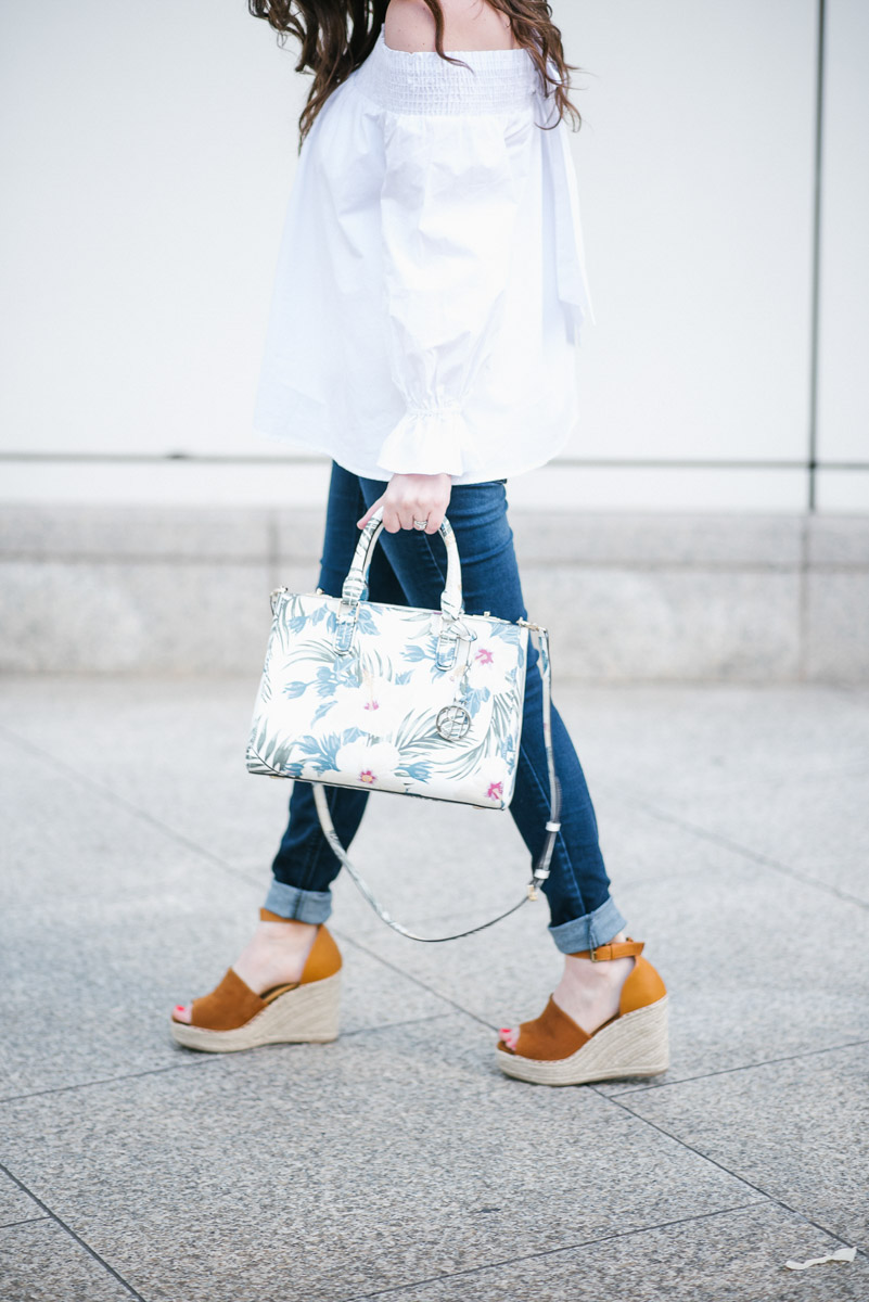 Houston fashion blogger styles a Henri Bendel floral handbag and Steve Madden wedges for spring outfit inspiration.