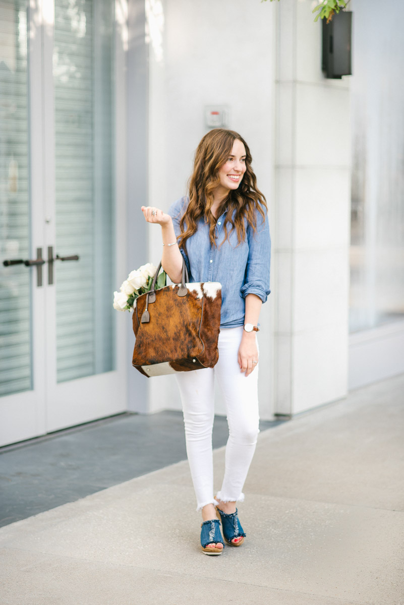 How to wear denim on denim with white jeans, a chambray top and denim Minnetonka wedges.