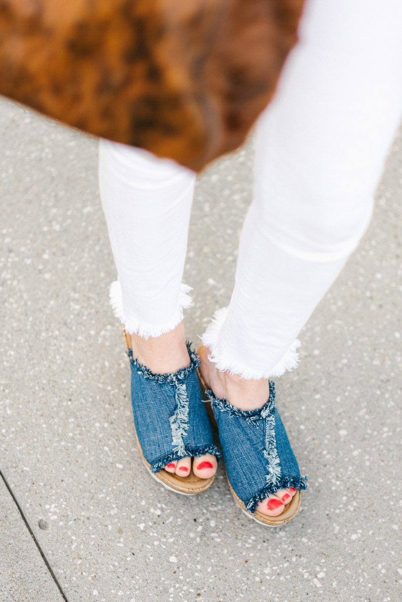 How to wear denim on denim with white jeans, a chambray top and denim Minnetonka wedges.