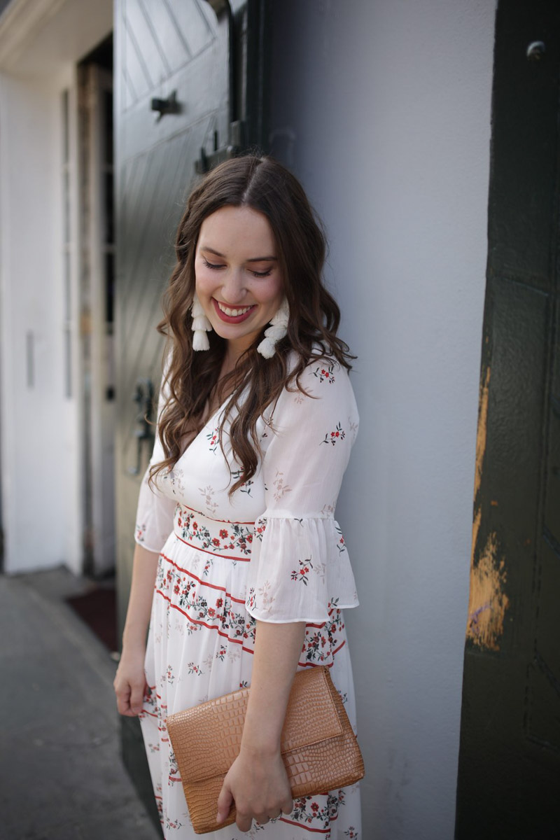 New Orleans fashion in the French Quarter. Blogger styles an Endless Rose red and white maxi dress with white misa tassel earrings.