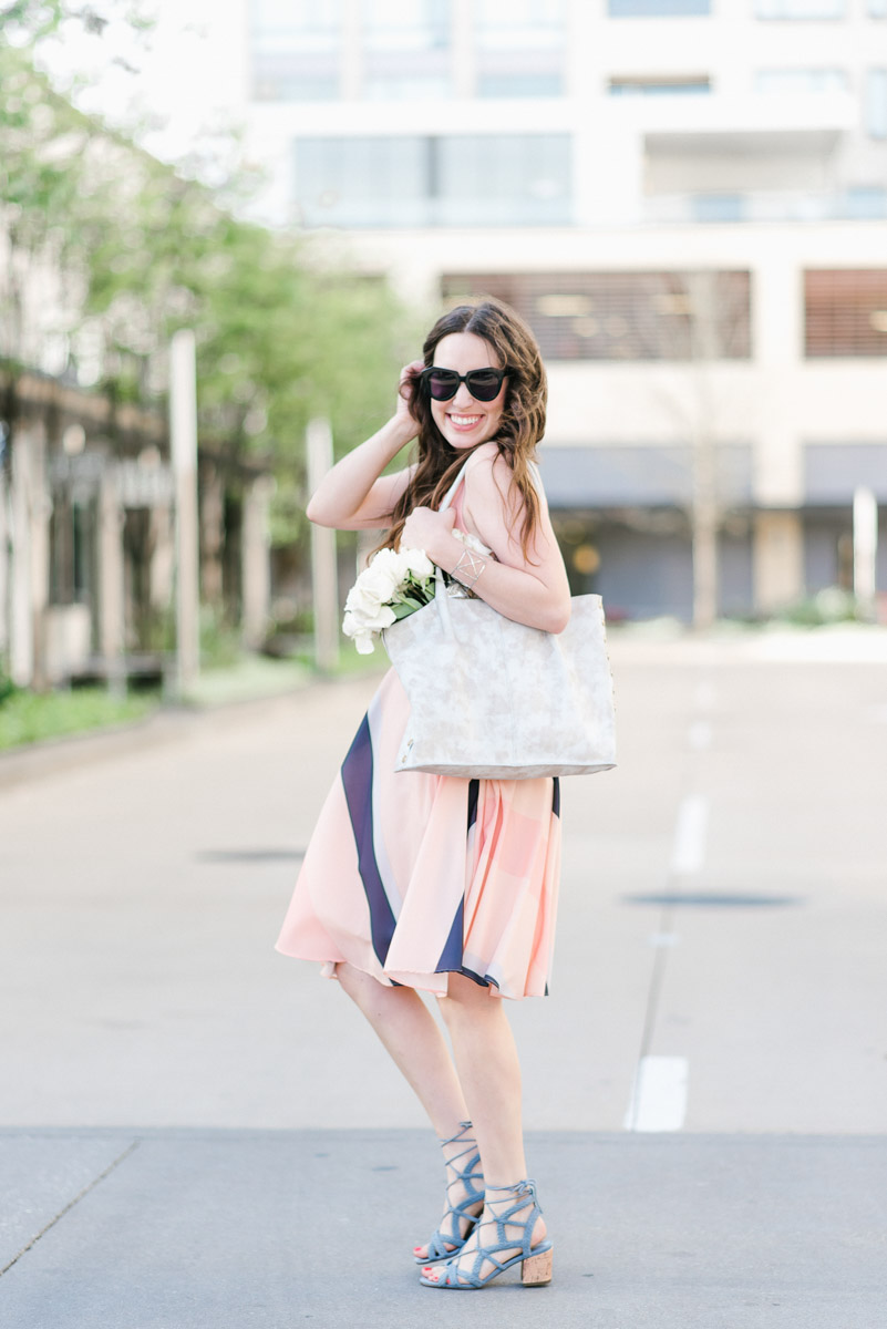 Houston fashion blogger styles a Papercrown pink striped dress with a white Hammit tote bag.x