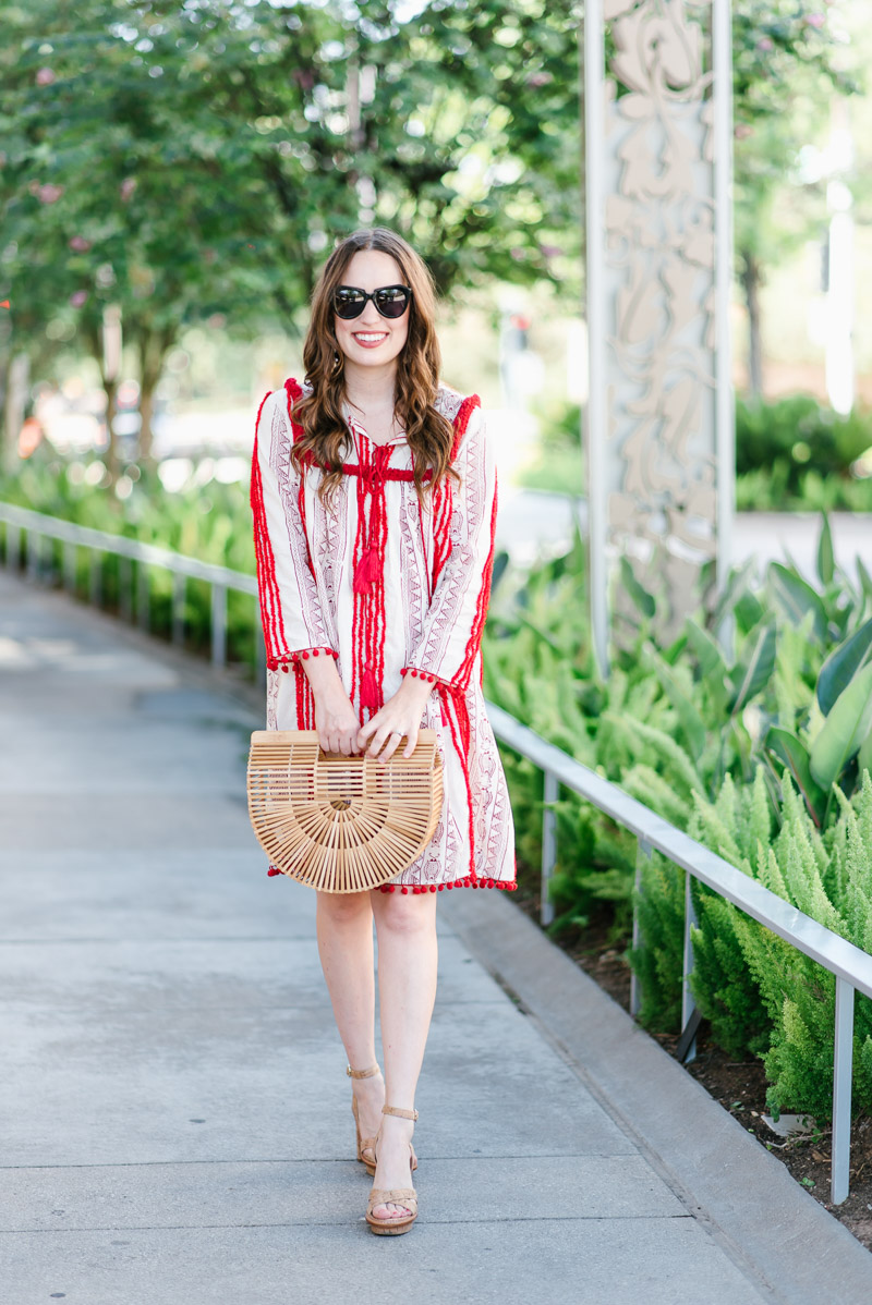 Beach outfit inspiration in Anthropologie's red pom pom Joselle dress. 
