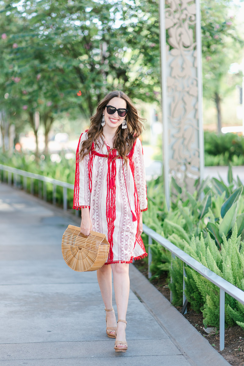 Beach outfit inspiration in Anthropologie's red pom pom Joselle dress. 