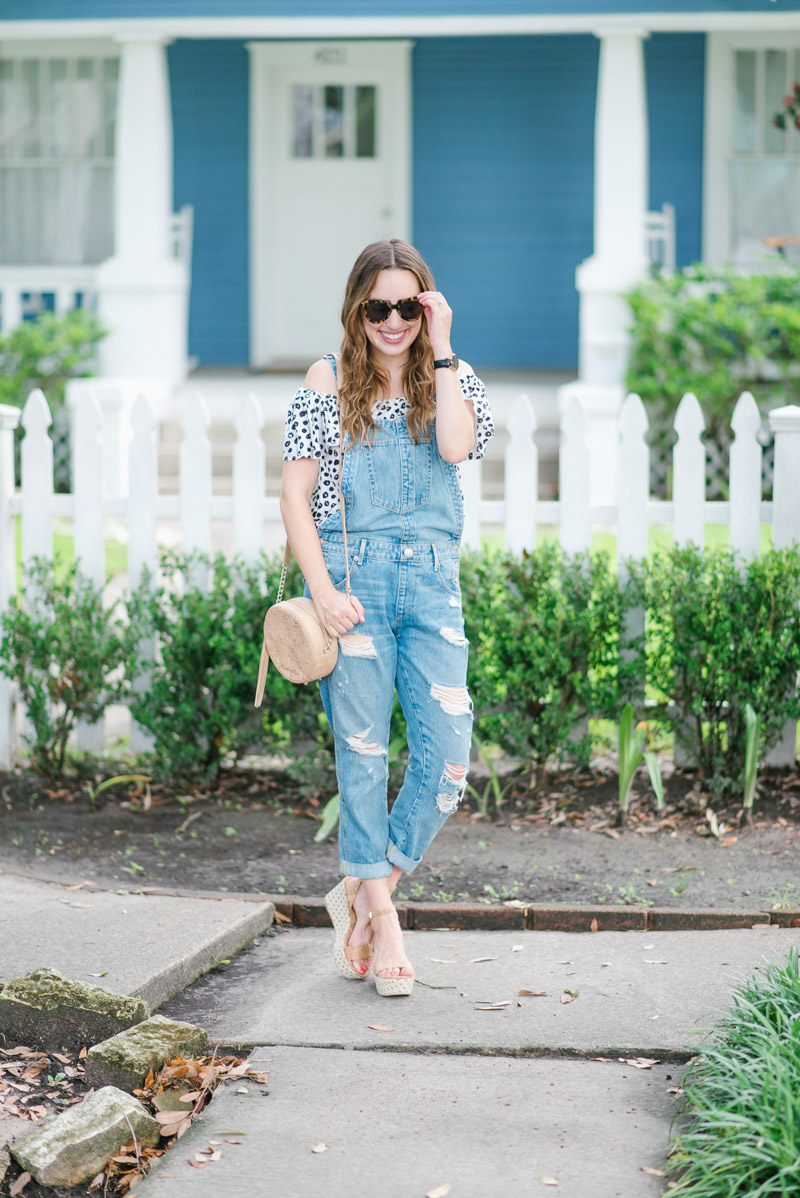 Houston fashion blogger styles overalls paired with an Anthropologie polka dot top.