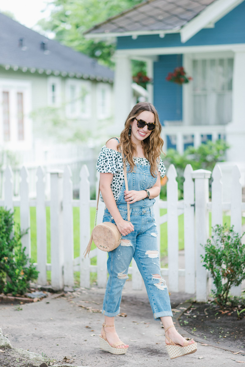 Anthropologie overalls paired with an off the shoulder polka dot top.