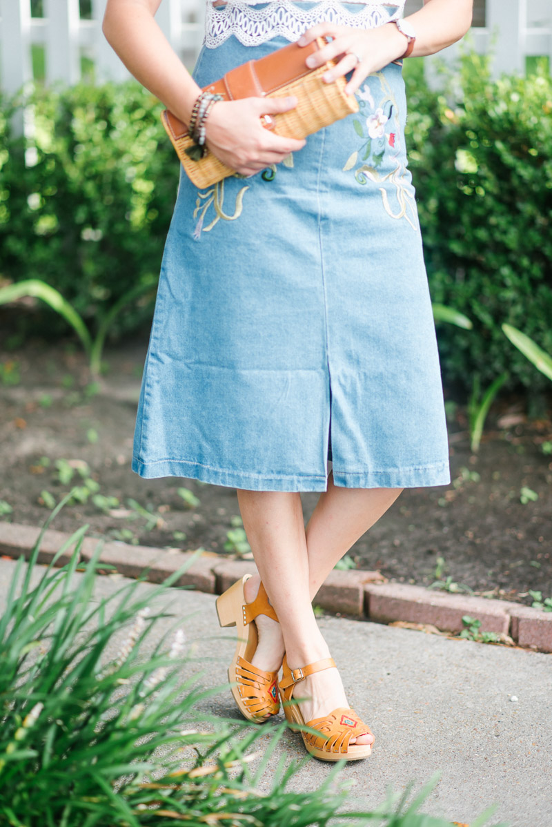 An embroidered denim midi skirt paired with Swedish Hasbeens sandals.
