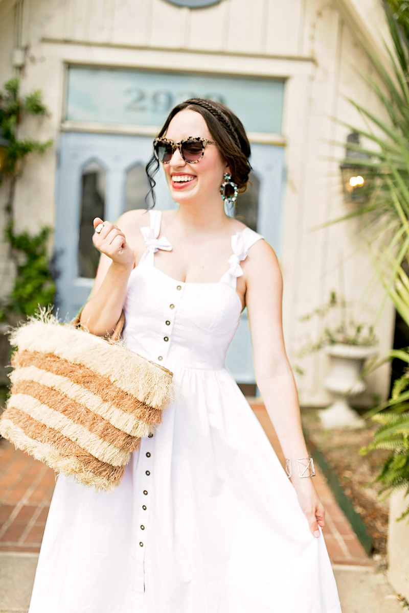 Texas blogger styles a white chichwish midi dress with a straw basket for summer.
