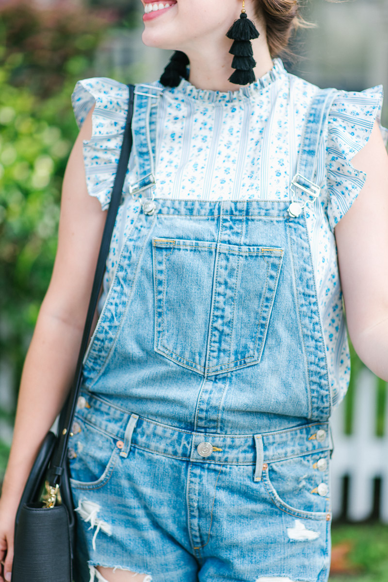 Distressed overalls with a ruffled tank for fall. 