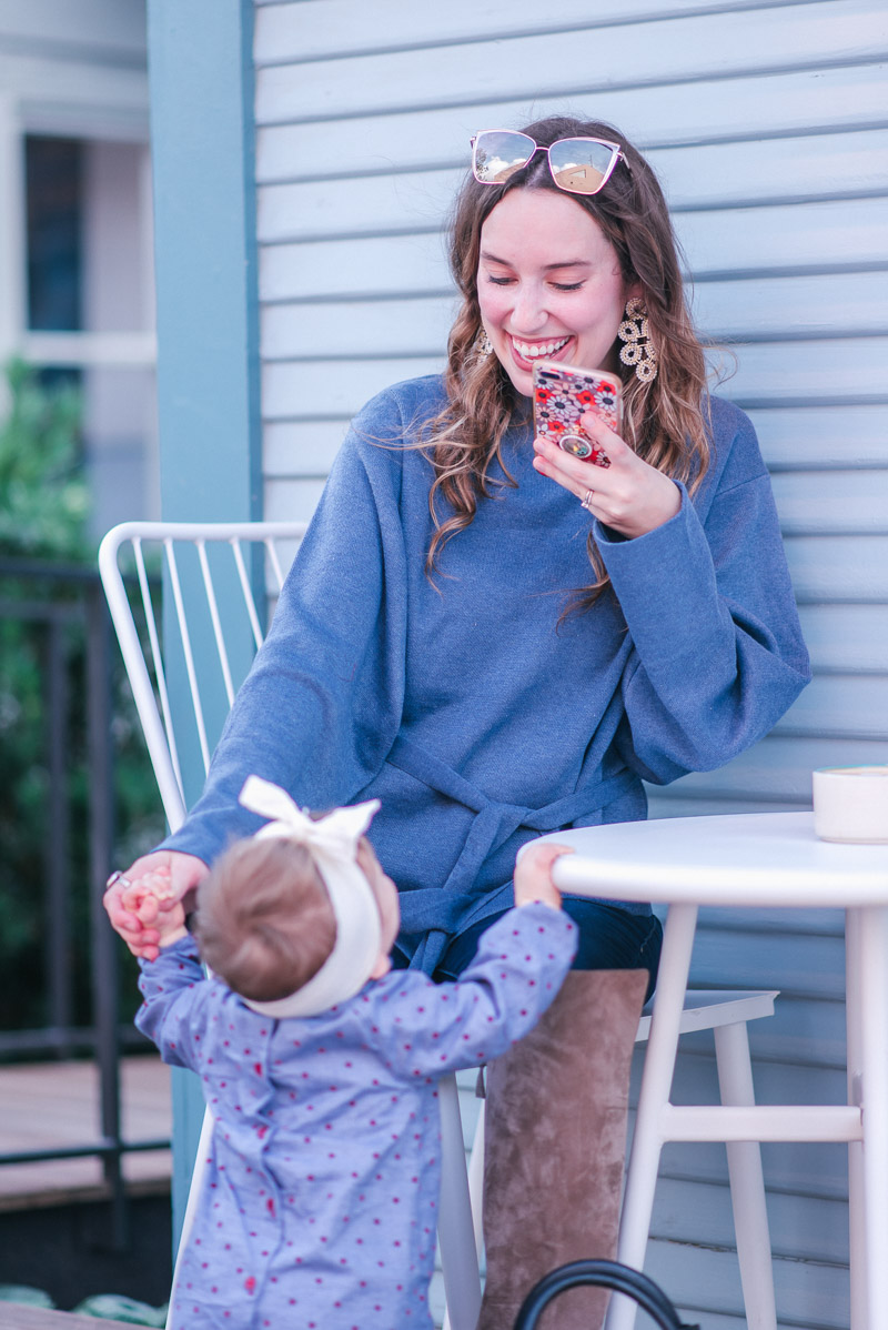 Mother Daughter Duo in a Boden Mini Polka Dot Dress, A goodnight Macaron Blue Sweater, and Lisi Lerch ginger Earrings.