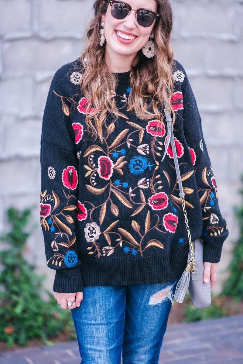 Texas fashion blogger styles a black floral embroidered sweater for fall.
