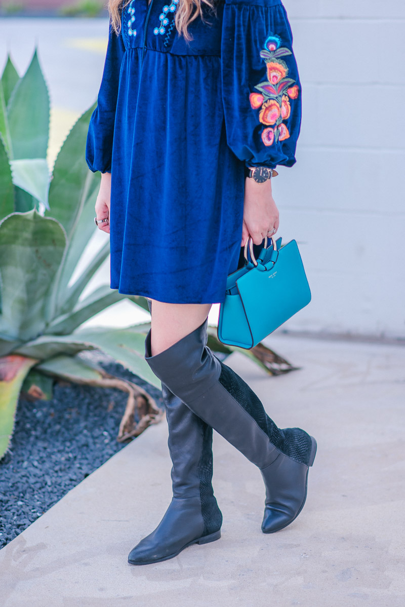 Navy Velvet Embroidered Dress with a Turquoise Henri Bendel Marquis Mini Satchel and black Seychelles Over the Knee Boots