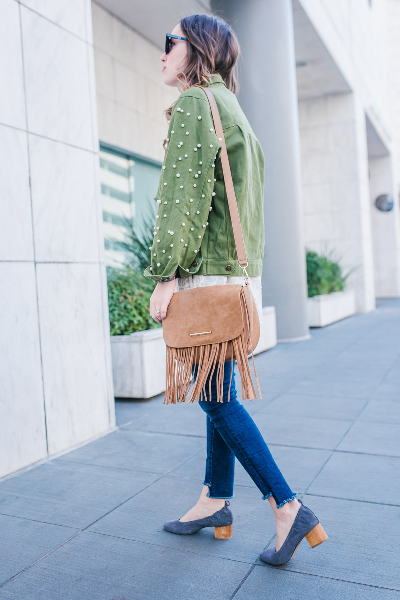 Spring layering outfit ideas with a green pearl anorak jacket and an Elaine Turner fringe crossbody. 