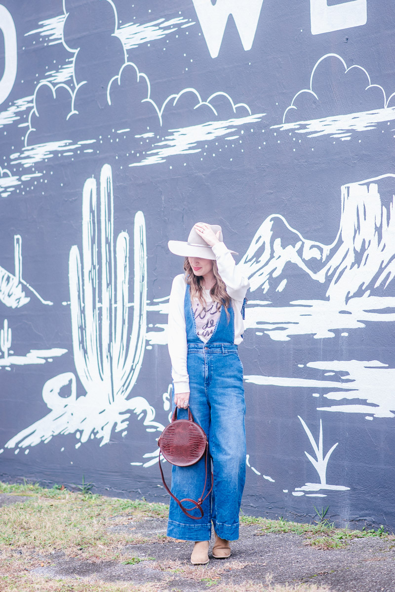 Western Boho Outfit in Free People Overalls, Anthropologie Sweatshirt and Hat Attack Hat. 