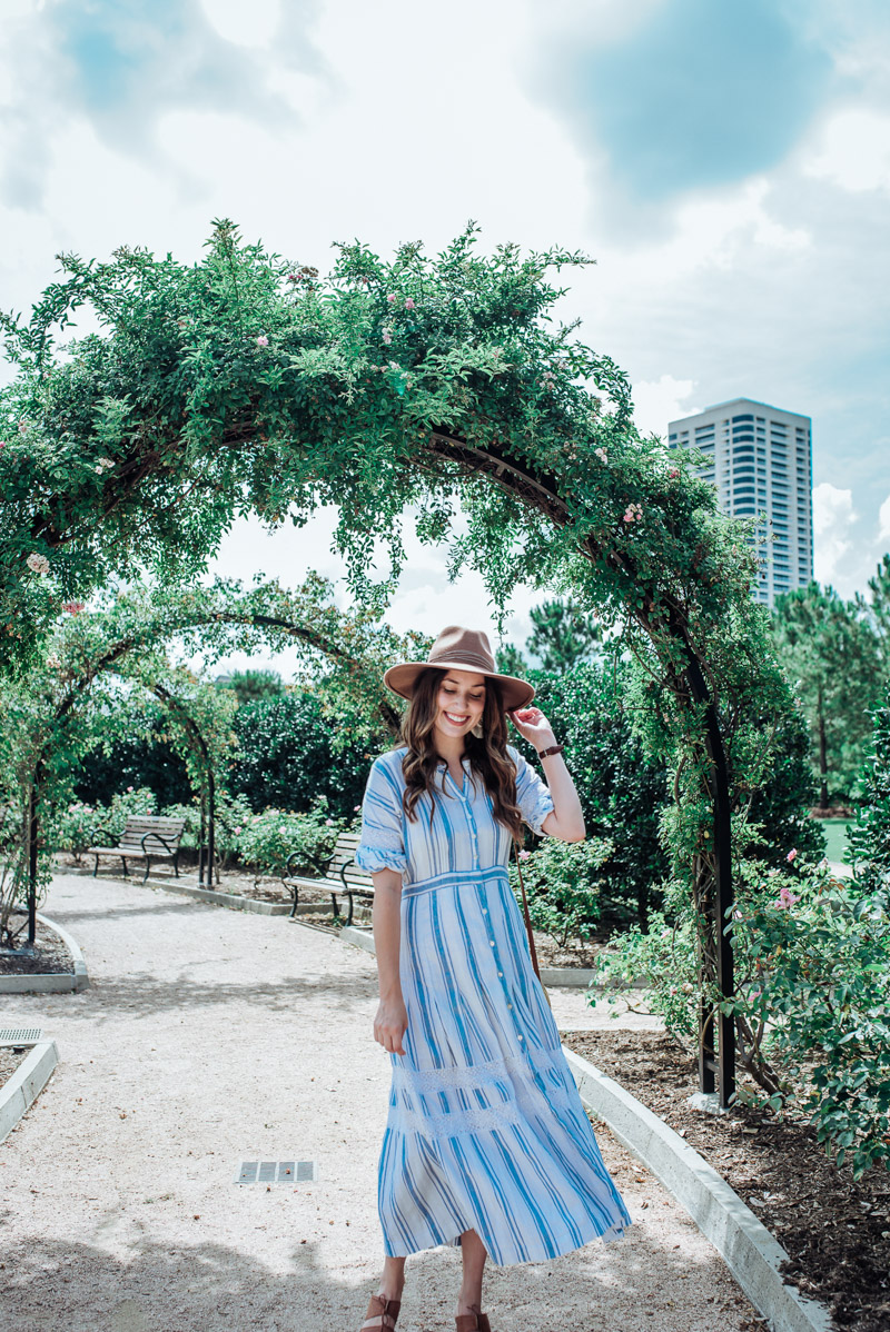 Houston blogger styles blue loveshackfancy dress for spring.