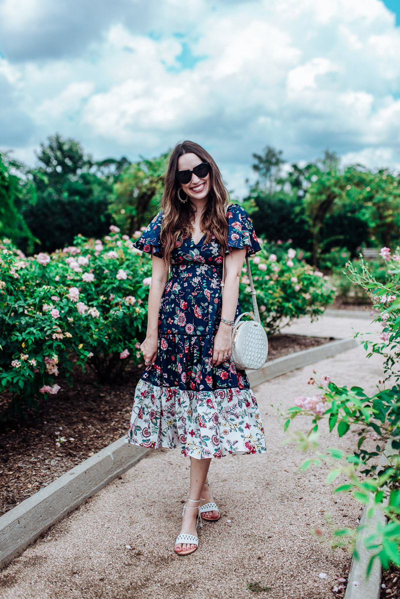 Houston blogger styles a navy floral Eliza J flutter sleeve dress for summer.