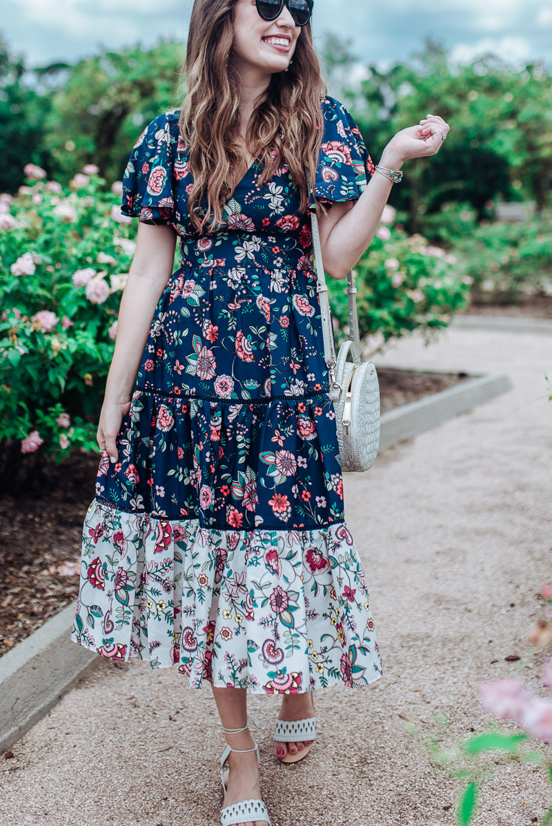 Houston blogger styles a navy floral Eliza J flutter sleeve dress for summer.