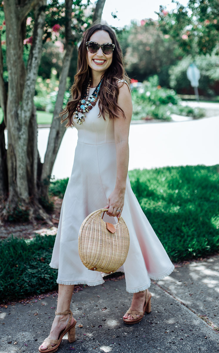 Houston fashion blogger styles an Eliza J pink fringe hem midi dress.