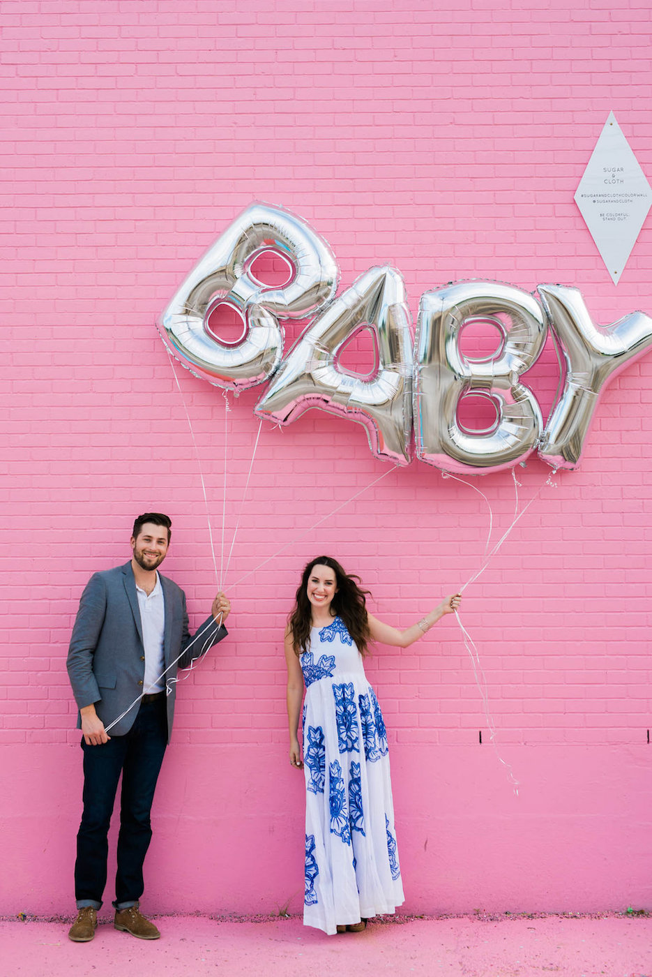 pink baby gender reveal ideas, baby balloon reveal, sugar and cloth color wall, baby balloons, silver baby balloons, baby girl reveal idea  | Pregnancy Announcement featured by top Houston life and style blog, Lone Star Looking Glass