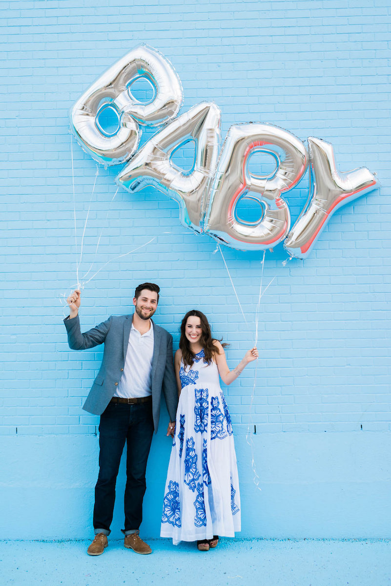 blue baby gender reveal ideas, baby balloon reveal, sugar and cloth color wall, baby balloons, silver baby balloons, baby boy reveal idea  | Pregnancy Announcement featured by top Houston life and style blog, Lone Star Looking Glass