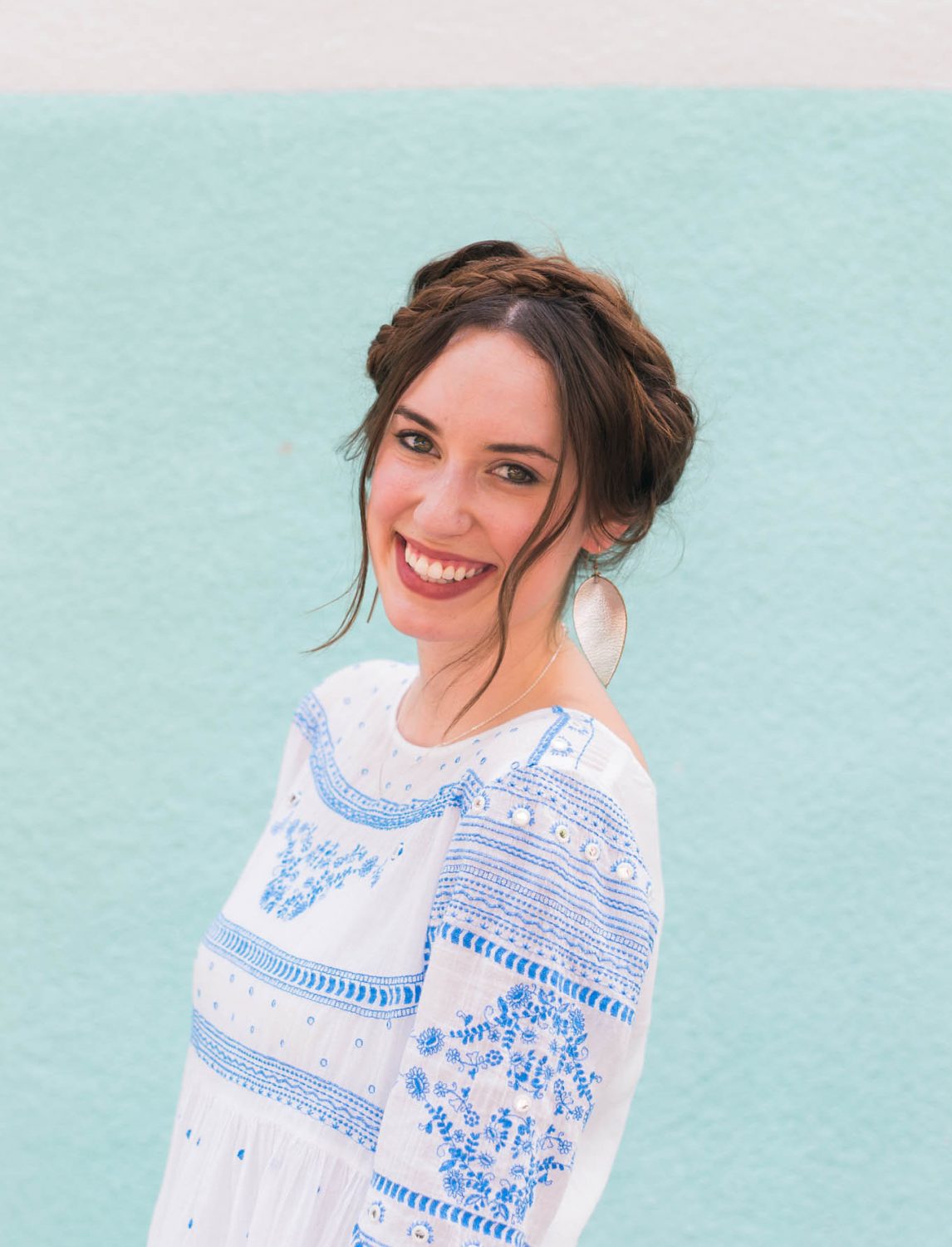 A super simple messy crown braid tutorial that takes less than 10 minutes, wearing Anthropologie's blue and white Meadowbrook Blouse