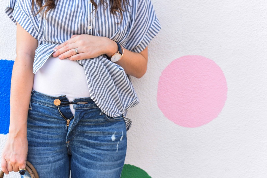 How to do wear your regular jeans when you're pregnant with the rubber band trick. |  | How to Wear Your Jeans While Pregnant featured by top US fashion blog, Lone Star Looking Glass: image of a pregnant woman wearing True Religion jeans and a Madewell striped top