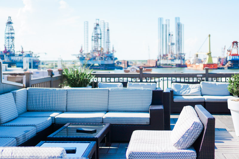 The Ultimate Galveston Travel Guide featured by top Houston travel blog, Lone Star Looking Glass: Tremont Hotel terrace