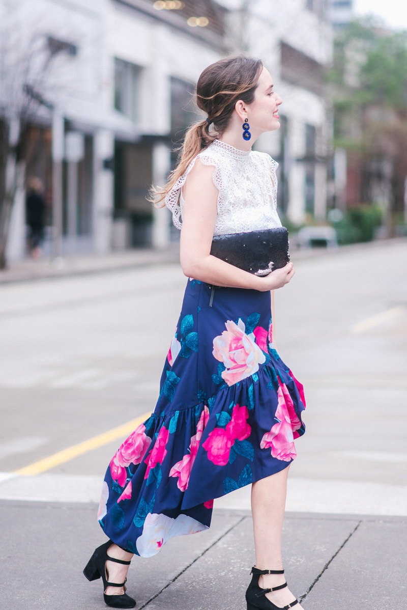 Eliza J Skirt styled for Valentine’s Day by top US fashion blog, Lone Star Looking Glass: image of a woman wearing a floral Eliza J skirt, Chicwish white crochet top, Stella& Dot sequin clutch, and Bella Vita pumps