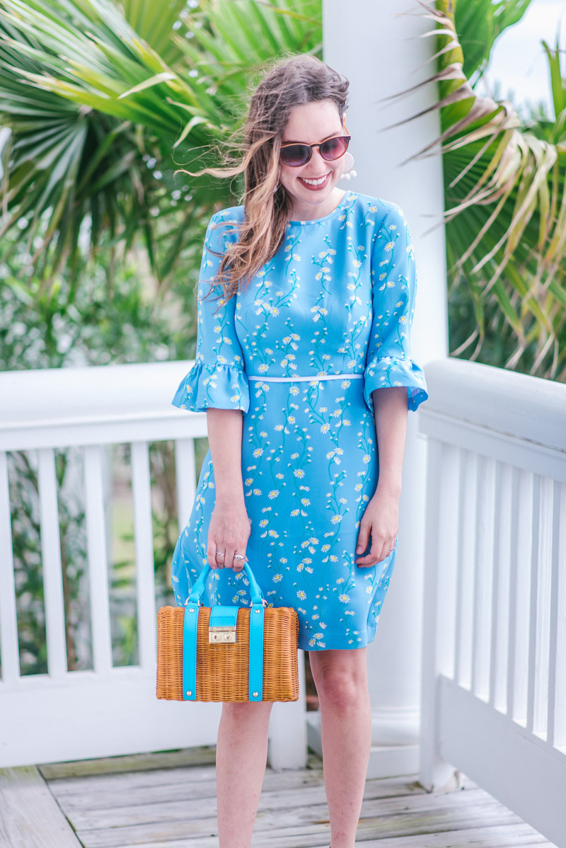 Things to Do in Houston in The Spring featured by top Houston blog Lone Star Looking Glass; Image of a woman wearing Draper James Vine Rosslyn Sundress and Draper James bag.